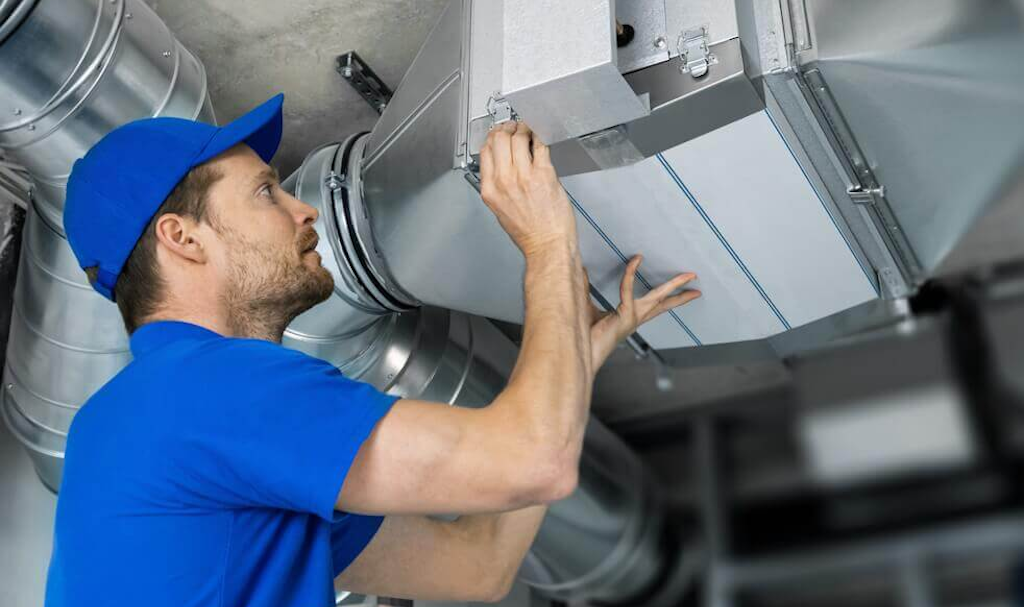 hvac technician performing maintenance