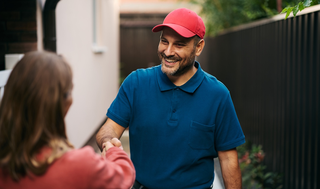 woman shaking contractors hand
